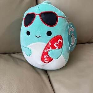 Squishmallows 7.5" Perry the Teal Dolphin with Sunglasses and Red Surfboard